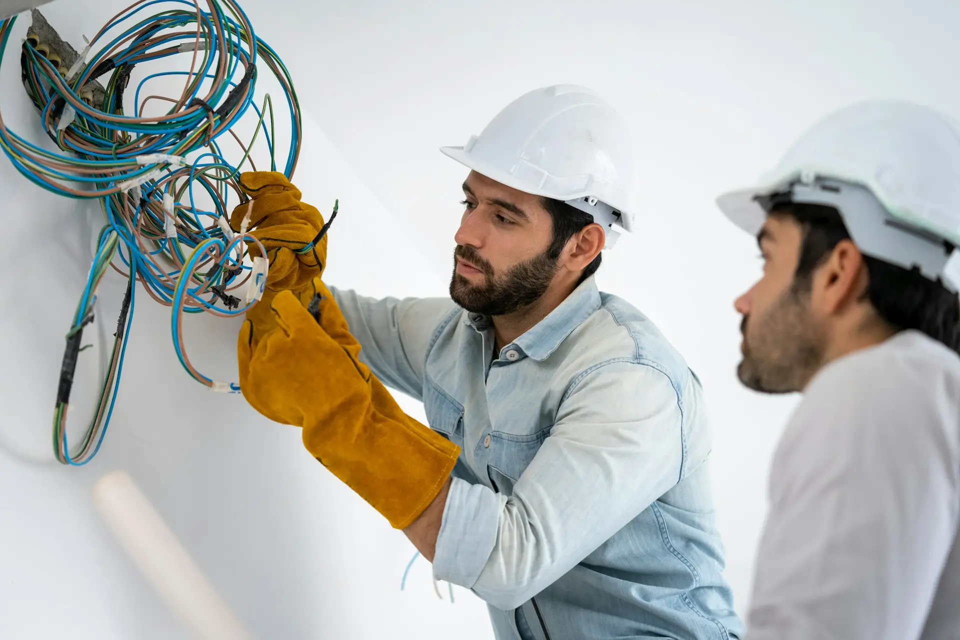 Electrician working working on building site, Maintenance technicians install wiring in the home.